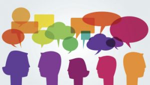 Man and woman head silhouettes with colorful speech bubbles